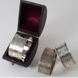 Three silver napkin rings hallmarked for Birmingham, 1886 & 1923 and Chester 1901. The Victorian