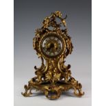 Victorian French gilt metal ormolu mantle clock with eloborate decoration, movement stamped 'Devaulx
