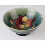Moorcroft 'Fresia' pattern green footed bowl, diameter 15.5cm approx.