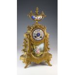 French gilt metal ormolu mantle clock with painted dial and ceramic tial beneath, circa 19th