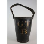 Leather fire bucket with metal studded rim, circa 19th century, leather carrying handle, 'G. T B'