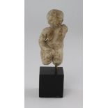 Greek marble head and torso, c.75mm high of a naked, winged cherub, set on a green bazed, wooden