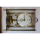 Kundo brass four glass mantle clock, key present, height 21.5cm approx.