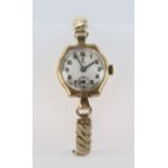 Ladies 9ct cased Tudor wristwatch on a later non gold expandable bracelet. Watch working when