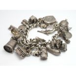 Heavy Silver / white metal charm bracelet with a good selection of charms attached, approx 119.4g