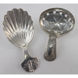 Two silver caddy spoons, one Georgian hallmarked for Joseph Taylor, Birmingham, 1810 and Levi &