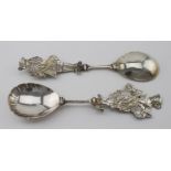 Two very fancy figural continental silver serving spoons both have two marks on the bowl which are a