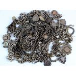 Large collection of mainly silver pocket watch chains, many with T bar/sporting medals/coins