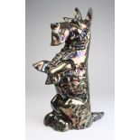 Cast iron fire dog / door stop, in the form of a Scottish Terrier, stamped to reverse 'Regd No