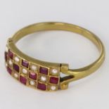 Yellow metal (tests 9ct) Ring set with Rubies and Seed Pearls size O weight 2.1g
