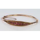 9ct Gold Ruby set Bangle with safety chain weight 5.4g