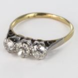 Yellow Metal (tests18ct) three stone Diamond Ring approx 0.65ct weight size K weight 2.1g