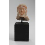 Roman terracotta bust of youthful female with Greecian features and thick hair possibly back of head