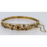9ct Gold Garnet set Bangle with Safety chain and clasp weight 12.4g