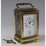 Brass five glass carriage clock by Rapport, with Roman numerals and subsidiary dial, key present
