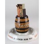 Guinness porcelain advertising ashtray, with barrel to centre encompassing a match box holder,