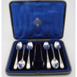 Boxed set of six silver teaspoons and one pair of sugar tongs. All hallmarked "HW, Sheffield, 1901".