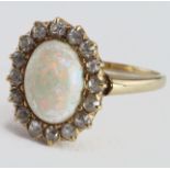 Yellow metal (tests 14ct) Opal and Diamong Ring size M weight 2.8g