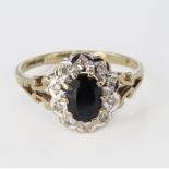 9ct Gold Ring with central Sapphire surrounded by CZ size L weight 2.3g