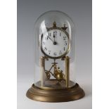 Brass anniversary clock, circa early 20th century, with glass dome, white enamel dial with Arabic