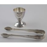 Edinburgh silver sugar tongs hallmarked for 1834 and a silver egg cup which appears to have