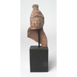 Terracotta bust and part of back, of a youthful soldier, clad in 'Persian' headress, c.112mm.