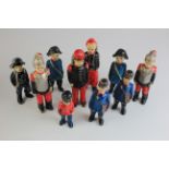 Ten French (?) wooden hand painted military figures, circa 19th century, including some soldiers,