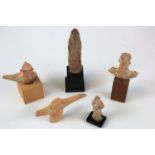 Five Ancient clay figures (four mounted on plinths), total height 15cm & smaller
