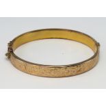 9ct Gold patterned Bangle with safety chain weight 9.1g