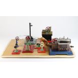 Mamod & Wilesco. A display board containing eight items including two stationary engines, a