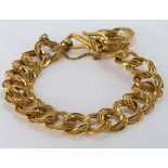 Yellow metal Bracelet (tests 22ct Gold) with safety chain weight 40.5g