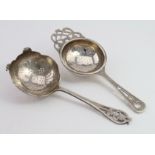 Two silver Tea Strainers hallmarked for Sheffield 1955 and Birmingham 1949. Weight 2¾ oz