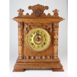 Eight day Seneca walnut mantle clock, by the Ansonia Clock Co., key and pendulum present, height