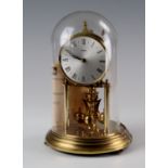 Kundo anniversary clock with dome, with key, height 22.5cm approx.