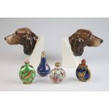Four perfume / scent bottles, together with a pair of Cocker Spaniel bookends, one with small chip