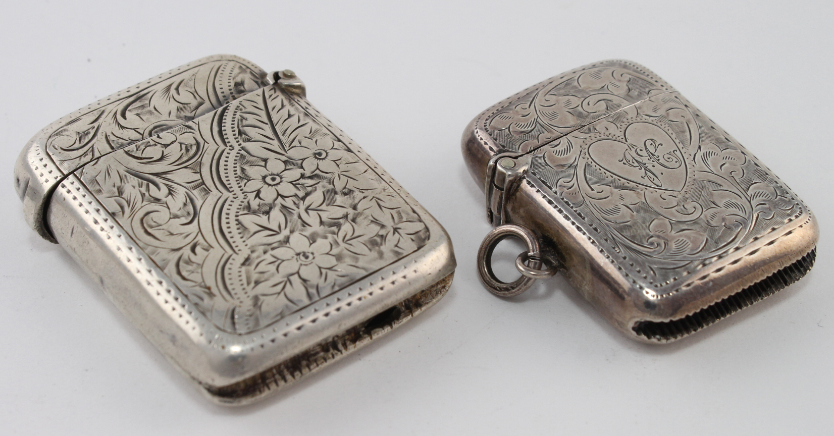 Two early silver engraved vesta cases, hallmarked for Birmingham 1899 & 1904. Makers - W.O. & J&C.