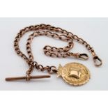 Hallmarked 9ct Gold pocket watch chain with "T" Bar & sporting medal, length approx. 34cm and