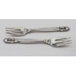 Two Georg Jensen silver forks marked "Georg Jensen, Sterling, Denmark" and Import marks for "