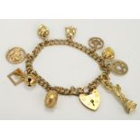 9ct Gold charm bracelet with ten charms attached, approx weight 18.4g