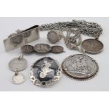 Mixed lot of silver mostly coin related includes a silver money clip and a silver plated long chain.