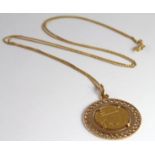 18ct Gold Arabic Pendant on a fine 18ct 24 inch chain weight 8.4g