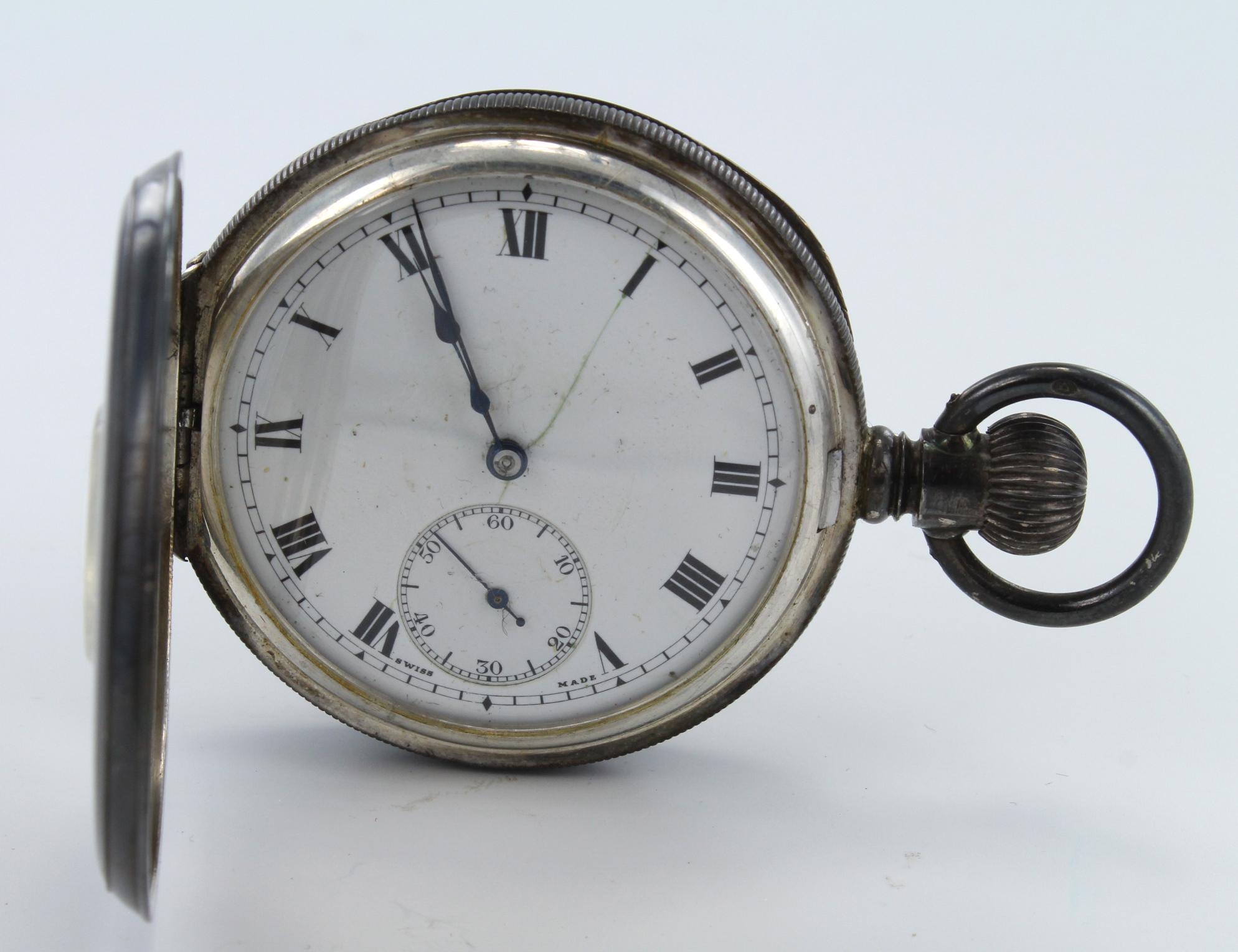 Silver half hunter pocket watch, the white dial with bold roman numerals and subsidiary second