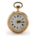 Ladies 18ct gold fob watch, the case with a foliage design and stamped inside 18k, approx 27mm