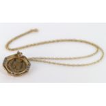 Half Sovereign 2002 in a stone set mount on a fine 18inch 9ct Gold chain weight 8.6 grams