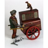 German tinplate clockwork organ grinder, by Distler, circa early 20th century, dancing monkey