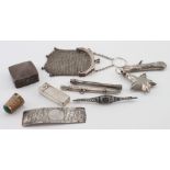 Mixed lot of ten silver items which includes a silver purse, small vesta, needle case, perfume