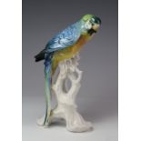 Karl Ens porcelain figure of a parrot, slight loss to foliage, height 24cm approx.