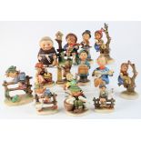 Fourteen Hummel figures, some damaged and repaired, sold as seen