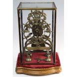 Victorian brass skeleton clock by W. E. Vale, Lichfield, pendulum and key present, stood on wooden