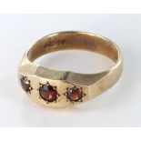 9ct Gold three stone Garnet set Gypsy style Ring size W weight 6.1g